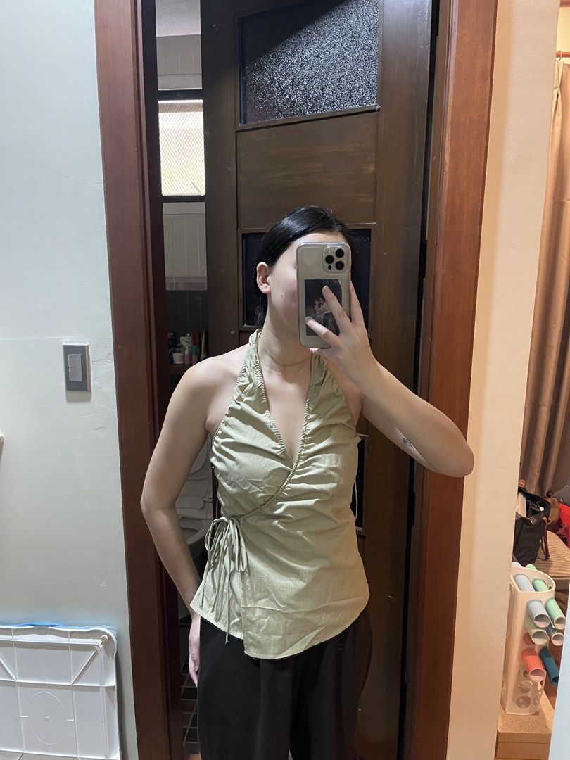 BNWT Zara Crossover Halter Top Sage Green (Category: Sleeveless) located in Davao. Submitted by julyanna522 (Listing ID 1465221993, Image 3). Description: - Brand new w/ tag - Color: Sage green - Style: Crossover halter top with V-neckline - Fit: True to size with adjustable side ties and garterized back (stretchable) - Available size: Large - For reference: wearing a size medium in the pic and I’m waist 27 bust 32 - + ₱50 sf.