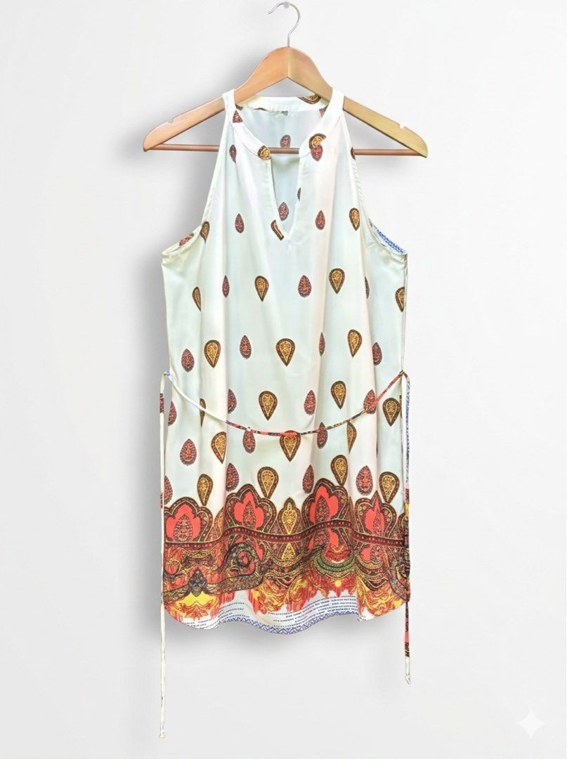 BOHO Paisley Halter Neck Mini Dress (Category: Dresses) located in Santo Domingo. Submitted by royal.teresa (Listing ID 1465314884, Image 1). Description: -super cute, lightweight sleeveless dress -perfect for warm days,beach trips or casual outings -vibrant orange,red and yellow paisley border print -adjustable thin waist tie to cinch your waist -can fit S-M.
