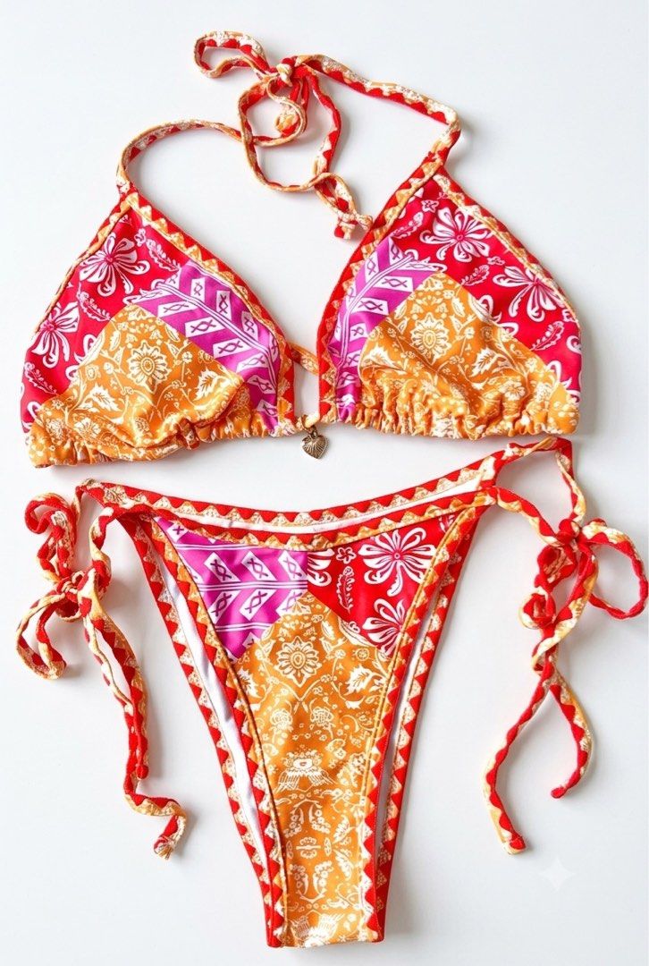 Boho Patchwork Print Triangle Bikini Set (Category: Bikinis & Swimsuits) located in Manila. Submitted by ynaamo (Listing ID 1465256382, Image 1). Description: - Vibrant red, orange, and magenta pattern - Triangle halter top with adjustable ties and cute center heart charm - Matching side-tie bottoms with adjustable strings - Playful ruffle trim along the edges - Brand new, perfect for summer and beach getaways.