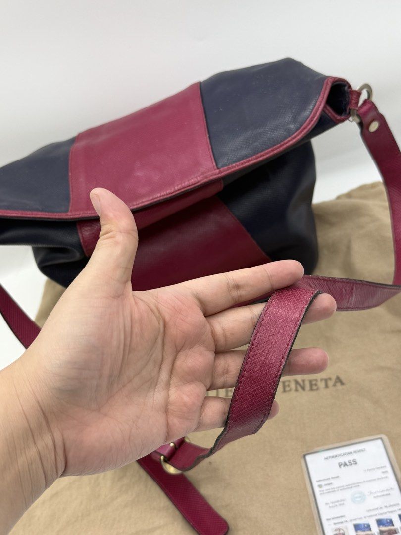 Bottega Veneta (Category: Cross-body Bags) located in Caloocan City. Submitted by rossvault2 (Listing ID 1465234758, Image 2). Description: - Authentic Bottega Veneta two-tone shoulder bag - Crafted from premium textured leather in navy and burgundy - Secure flap closure with magnetic snap - Adjustable matching burgundy leather strap - Interior zipped pocket featuring the metal 'Bottega Veneta Made in Italy' logo plaque - Includes original dust b