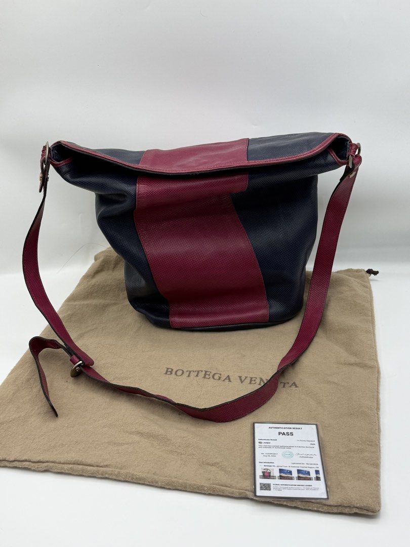 Bottega Veneta (Category: Cross-body Bags) located in Caloocan City. Submitted by rossvault2 (Listing ID 1465234758, Image 1). Description: - Authentic Bottega Veneta two-tone shoulder bag - Crafted from premium textured leather in navy and burgundy - Secure flap closure with magnetic snap - Adjustable matching burgundy leather strap - Interior zipped pocket featuring the metal 'Bottega Veneta Made in Italy' logo plaque - Includes original dust b