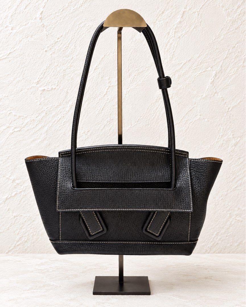Bottega Veneta Leather Tote (Category: Shoulder Bags) located in Makati City. Submitted by stylehub.mnl (Listing ID 1465188682, Image 1). Description: Vintage Bottega Veneta Leather Tote 🖤 ₱15,000 Made in Italy 🇮🇹 • Black textured leather • Beautiful contrast stitching • Tan suede-lined interior • Spacious and structured silhouette • Classic, timeless design • Comes with natural vintage character and signs of age A gorgeous vintage luxury piec