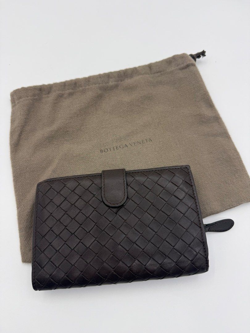 Bottega Veneta wallet (Category: Wallets & Card holders) located in Caloocan City. Submitted by rossvault2 (Listing ID 1465238493, Image 1). Description: - Bottega Veneta dark brown leather wallet - Iconic signature intrecciato weave pattern - Secure snap button closure on front flap - Organized interior with multiple card slots and zipped coin compartment - Clean condition, well-maintained inside and out - Includes original dust bag/ normal sign