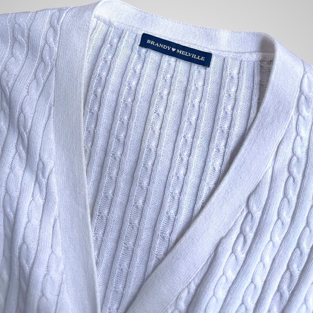 Brandy Melville White Cable Knit Cardigan (Category: Coats, Jackets and Outerwear) located in Calamba. Submitted by sellinggrannyscloset (Listing ID 1465374408, Image 3). Description: BRANDY MELVILLE KNITTED SIZE: M-L LENGTH: 17.5 WIDTH: 19 CONDITION: 9/10 ISSUE: X.
