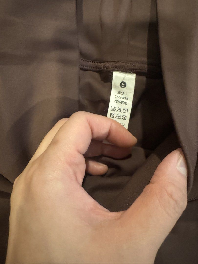 Brown Pleated Athletic Skirt Size 6 (Category: Skirts) located in Muntinlupa City. Submitted by myabcshop (Listing ID 1465196439, Image 2). Description: - Size: 6 (tag attached) - Color: Brown - Material: 75% nylon, 25% spandex (soft, stretchy, and comfortable) - Fit: High waist with built-in shorts and a cute side hem split - Ideal for: Tennis, golf, running, and workouts - Condition: Clean and excellent all around Used once / wrong size.