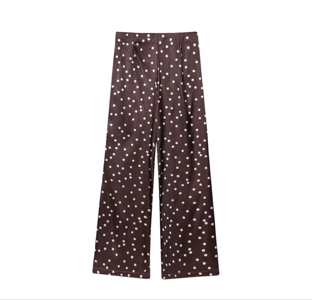 Brown Polka Dot Wide Leg Trousers (Category: Sets or Coordinates) located in Paranaque City. Submitted by curatedbyvien (Listing ID 1465336631, Image 2). Description: Brown wide-leg pants with white polka dots all over. High-waisted fit with a clean waistband and side zipper closure. Soft, smooth fabric with plenty of drape. Straight hem with neat stitching. Easy to dress up or keep casual..