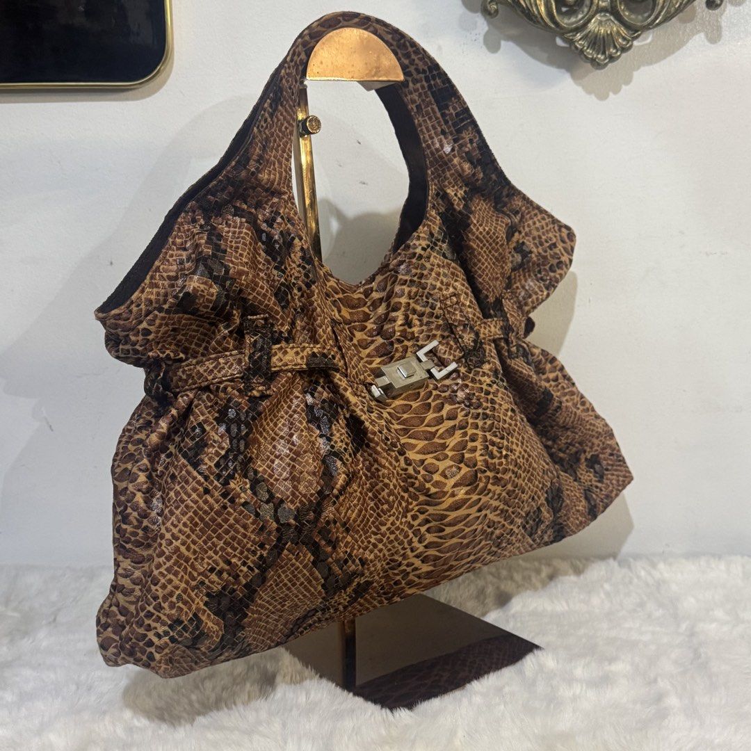 Brown Python Snake print canvas handbag (Category: Shoulder Bags) located in Rizal. Submitted by houseofbell (Listing ID 1465373416, Image 2). Description: Material :canvas Dimensions: 16.5x9 inches .