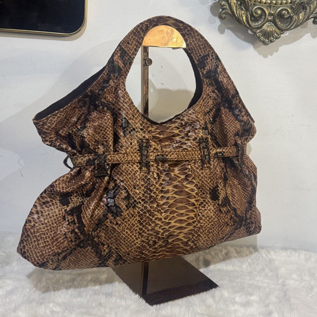 Brown Python Snake print canvas handbag (Category: Shoulder Bags) located in Rizal. Submitted by houseofbell (Listing ID 1465373416, Image 3). Description: Material :canvas Dimensions: 16.5x9 inches .