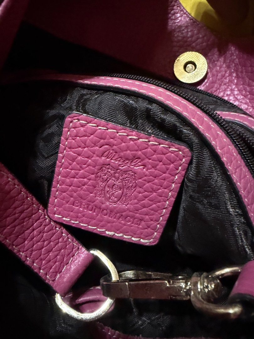 Bruno Magli Pink Pebbled Leather Tote Bag (Category: Luxury Bags & Wallets) located in Manila. Submitted by lynnalec25 (Listing ID 1465363003, Image 3). Description: - Brand: Bruno Magli - Material: Soft bright pink pebbled leather with white contrast stitching - Hardware: Gold-tone accents with side studs and branded zipper pull - Interior: Dark patterned lining with a branded leather patch and secure zipper compartments - Straps: Comfortable du