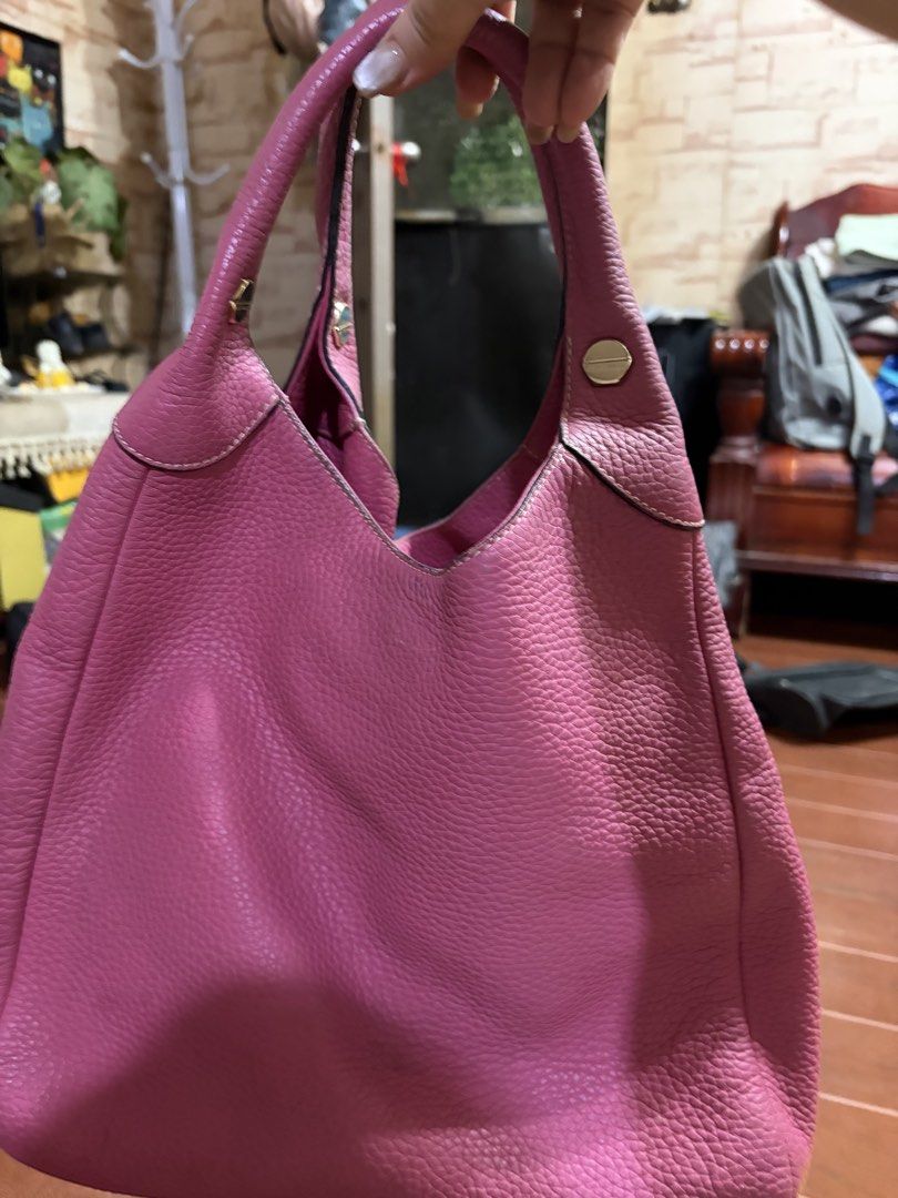 Bruno Magli Pink Pebbled Leather Tote Bag (Category: Luxury Bags & Wallets) located in Manila. Submitted by lynnalec25 (Listing ID 1465363003, Image 2). Description: - Brand: Bruno Magli - Material: Soft bright pink pebbled leather with white contrast stitching - Hardware: Gold-tone accents with side studs and branded zipper pull - Interior: Dark patterned lining with a branded leather patch and secure zipper compartments - Straps: Comfortable du