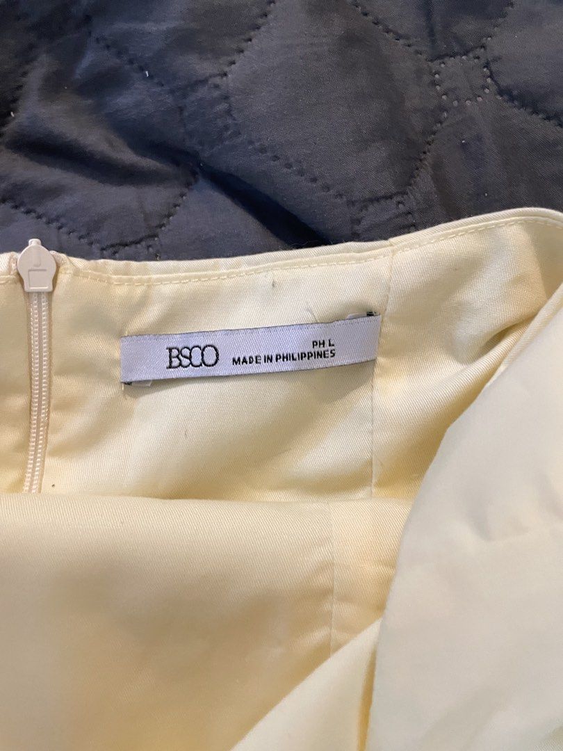 BSCO Josie Top Halter Backless Top (Category: Sleeveless) located in Manila. Submitted by finderskeepersmnl_092026 (Listing ID 1465235443, Image 3). Description: - Brand/Model: BSCO Josie Top - Color: Cream Yellow - Size: Large - Design: Halter neck with back button closure, backless cut, and flared peplum hem - Closure: Side zipper - Origin: Made in the Philippines - Occasion: Great for casual outings or parties.