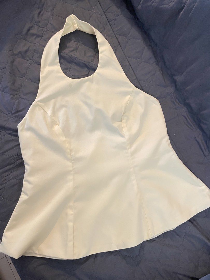 BSCO Josie Top Halter Backless Top (Category: Sleeveless) located in Manila. Submitted by finderskeepersmnl_092026 (Listing ID 1465235443, Image 1). Description: - Brand/Model: BSCO Josie Top - Color: Cream Yellow - Size: Large - Design: Halter neck with back button closure, backless cut, and flared peplum hem - Closure: Side zipper - Origin: Made in the Philippines - Occasion: Great for casual outings or parties.