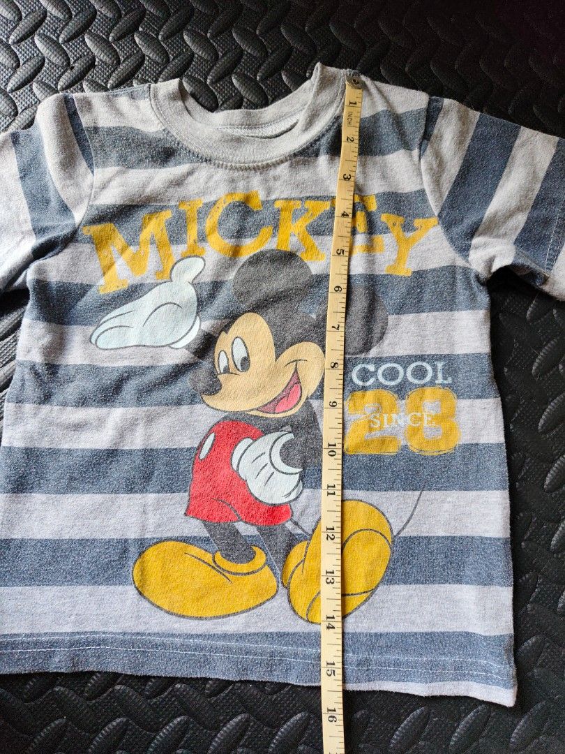 Bundle of 3 - Top (2 to 4 yrs old) (Category: Babies & Kids Fashion) located in Quezon City. Submitted by zs.onlinehub (Listing ID 1465189743, Image 3). Description: - Design: Grey and blue striped with large Mickey Mouse graphic and yellow lettering - Size: 3T (Made in Egypt) - Fit: 13 to 14 inches pit-to-pit - Condition/Use: Casual everyday top for toddlers - Deal: Feel free to message for inquiries or bundle discounts!.