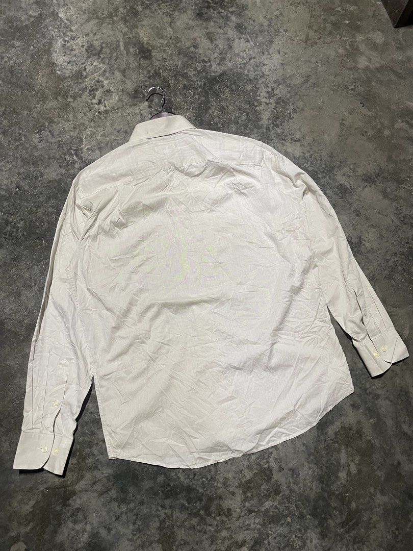 Burberry Button-Down Long Sleeve Shirt Beige (Category: Formal Shirts) located in Polomolok. Submitted by madagascarts (Listing ID 1465315756, Image 3). Description: - Authentic Burberry long-sleeve button-down shirt in classic beige - Features a traditional collar and single chest pocket with embroidered logo detail - Regular fit with adjustable single-button barrel cuffs - Versatile and stylish piece, ideal for smart casual wear - Condition: Ex