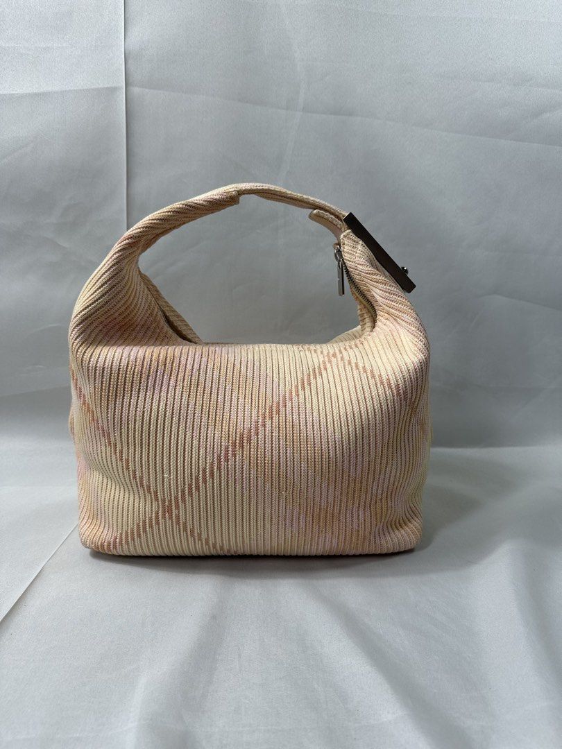 Burberry Mini Peg Duffle Check Bag (Category: Luxury Bags & Wallets) located in Cabanglasan. Submitted by thefashiongarage.co (Listing ID 1465223249, Image 3). Description: Title - Burberry Prorsum Model/Name - Mini Peg Check Duffle Bag Size on Tag - Mini Conditiion - Excellent Condition with no issue Dimension (WxLxH) - 12x9x6 inches Category- Luxury Fitting - Made in - Italy Material - Knitted Color - Caramel Design - Plaid Check Year - Inclusi