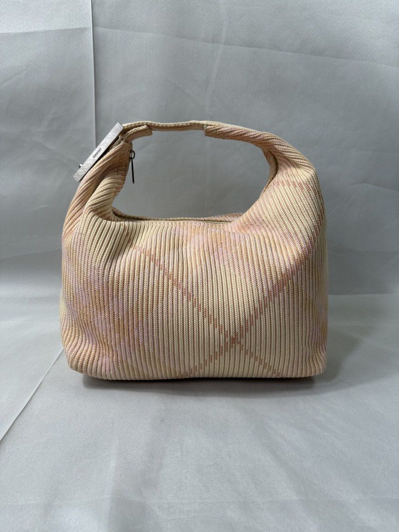 Burberry Mini Peg Duffle Check Bag (Category: Luxury Bags & Wallets) located in Cabanglasan. Submitted by thefashiongarage.co (Listing ID 1465223249, Image 2). Description: Title - Burberry Prorsum Model/Name - Mini Peg Check Duffle Bag Size on Tag - Mini Conditiion - Excellent Condition with no issue Dimension (WxLxH) - 12x9x6 inches Category- Luxury Fitting - Made in - Italy Material - Knitted Color - Caramel Design - Plaid Check Year - Inclusi