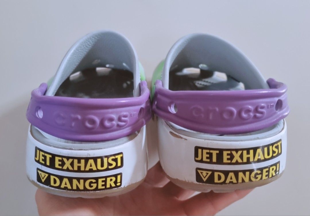 Buzz Lightyear Toy Story Crocs J1 (Category: Babies & Kids Fashion) located in Danao, Cebu. Submitted by CaxeCart (Listing ID 1465224014, Image 3). Description: - Authentic Buzz Lightyear theme Crocs clogs - Iconic green, white, and purple colorway with Toy Story graphics - Classic 'ANDY' signature written inside the left shoe - Comes with extra Jibbitz charms already attached - Cool laser and jet exhaust decals printed on the heels - Comfortable