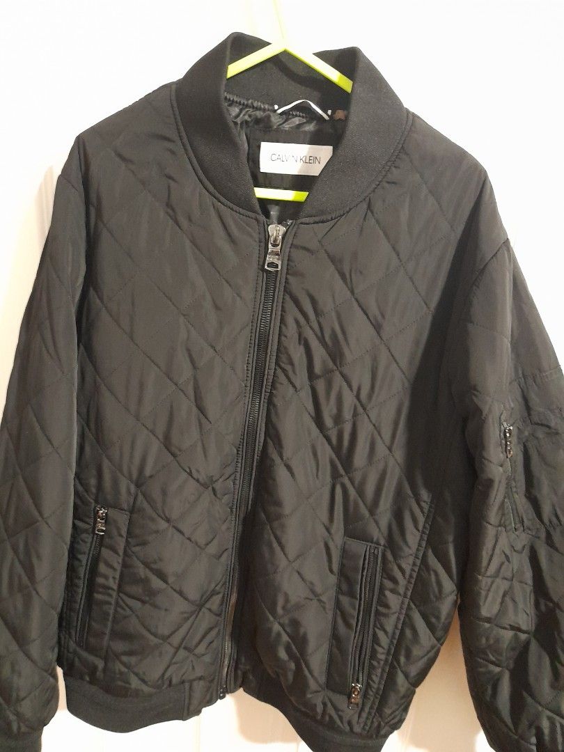 Calvin Klein Authentic CK winter jacket (Category: Coats, Jackets and Outerwear) located in Cavite. Submitted by csdepot (Listing ID 1465262332, Image 1). Description: Authentic CK winter jacket Color: Dark Black (in actual) With pockets in front and on arms Size: Medium /US 40 Bought from the US.