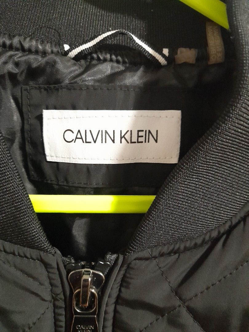 Calvin Klein Authentic CK winter jacket (Category: Coats, Jackets and Outerwear) located in Cavite. Submitted by csdepot (Listing ID 1465262332, Image 2). Description: Authentic CK winter jacket Color: Dark Black (in actual) With pockets in front and on arms Size: Medium /US 40 Bought from the US.