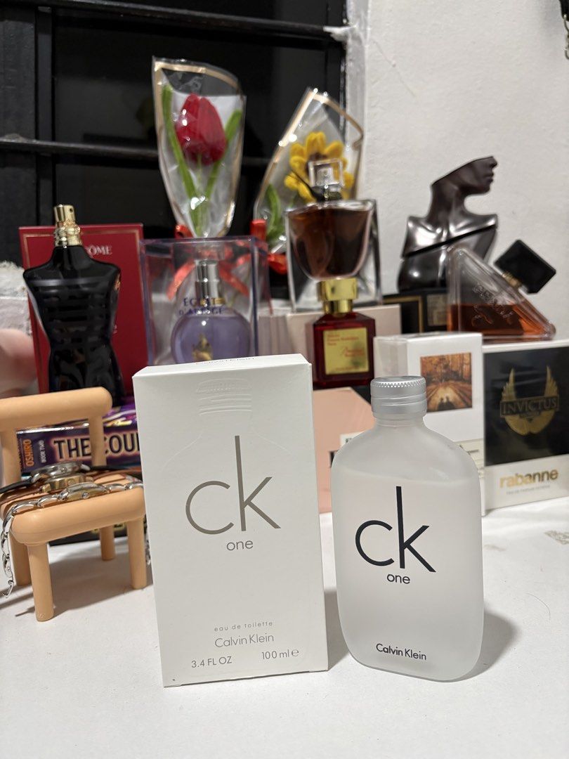 Calvin Klein CK One Eau de Toilette 100ml (Category: Fragrance & Deodorants) located in Caloocan City. Submitted by esnairahhh (Listing ID 1465379524, Image 1). Description: - Tester Calvin Klein CK One Eau de Toilette - Size: 100ml / 3.4 FL OZ - Classic, fresh unisex scent - Comes with original, clean white packaging box - Frosted glass bottle with iconic black text branding - Perfect for daily use or gifting.