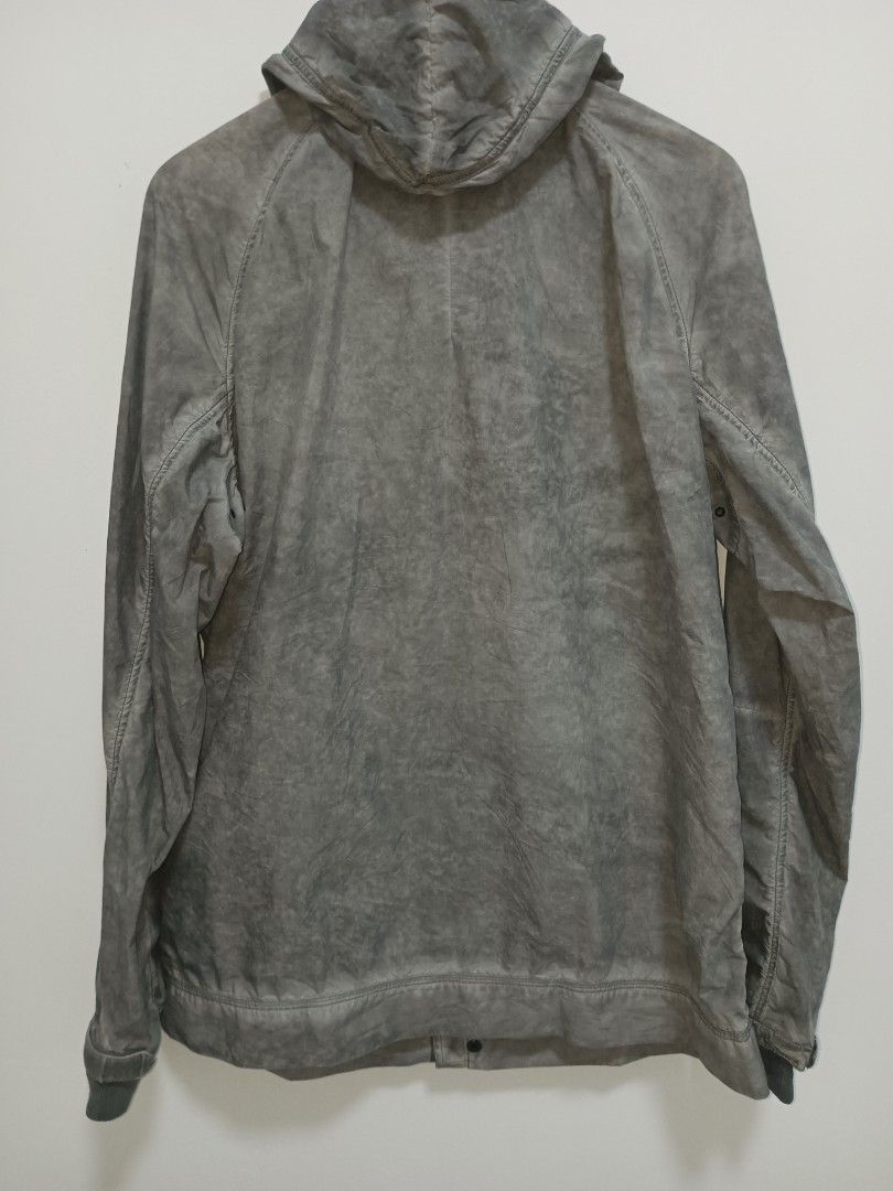 Calvin Klein Jeans Grey Hooded Jacket (Category: Coats, Jackets and Outerwear) located in Jolo. Submitted by zah-zah (Listing ID 1465382159, Image 2). Description: - Brand: Calvin Klein Jeans - Color: Grey - Size: XL - Material: 61% cotton, 39% nylon - Closure: Full front zipper with snap button storm flap - Features: Adjustable hood drawstrings, 2 large front flap pockets, ribbed wrist cuffs, and metal logo plate on sleeve.