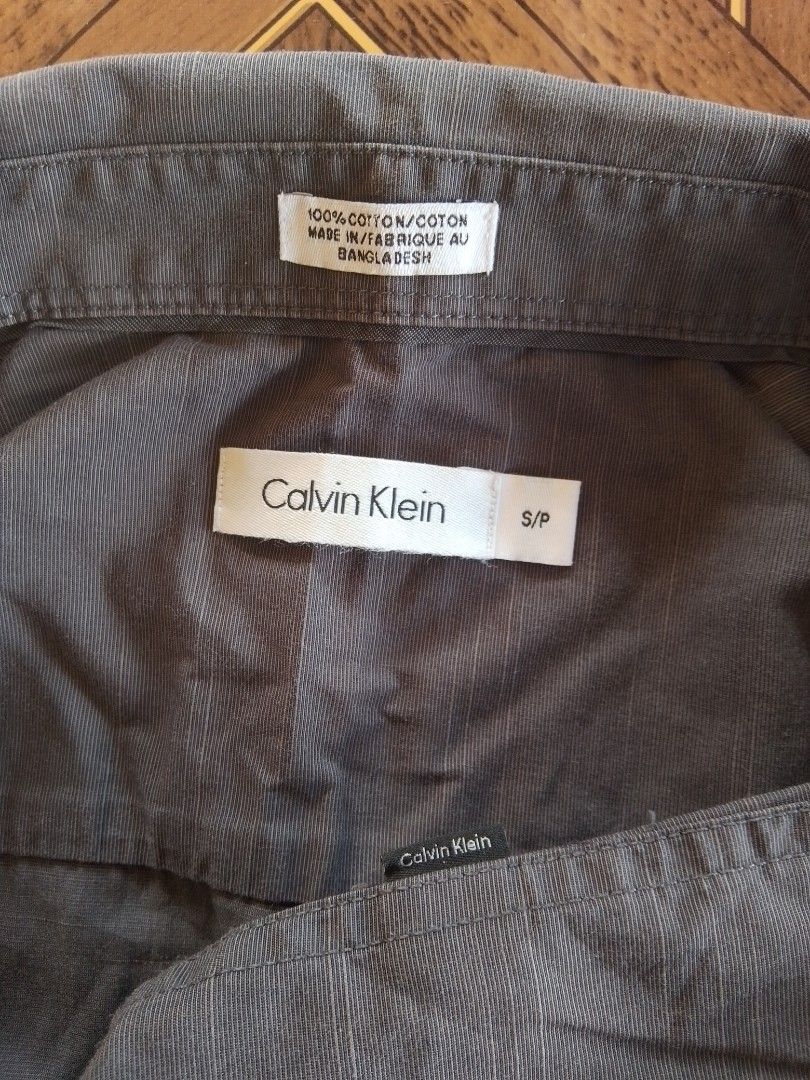 Calvin Klein •polo (Category: Tshirts & Polo Shirts ) located in Batangas. Submitted by 68.thrifts (Listing ID 1465228215, Image 2). Description: size: 20.5 x 28 color: charcoal grey issue: frayed hole on sleeve.