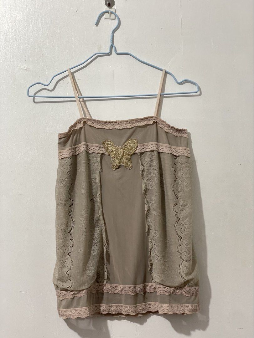 Cami Top with glittered butterfly Design (Category: Sleeveless) located in Tuguegarao City. Submitted by ziggerryy (Listing ID 1465370059, Image 1). Description: No flaws. No holes S-M .