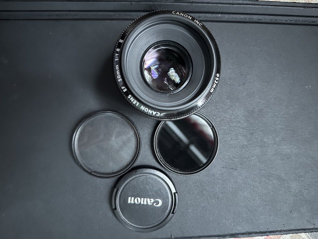 CANON 50MM LENS (Category: Lens & Kits) located in Mangaldan. Submitted by kapty (Listing ID 1465172137, Image 2). Description: CANON 50MM LENS MINIMAL FUNGUS AUTOFOCUS WORKING WITH 2 UV FILTER ALL WORKING NEGOTIABLE.