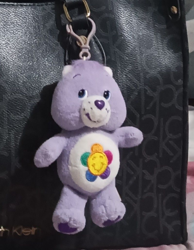 Care Bears Harmony Bear Plush Keychain 2003 (Category: Plushies & Soft Toys) located in Manila. Submitted by cililopez (Listing ID 1465285593, Image 1). Description: Authentic 2003 Care Bears Harmony Bear plush keychain in clean condition. Features the iconic flower belly badge, purple heart foot detail, and an attached clip for easy hanging. Perfect for bag charms or collectors!.
