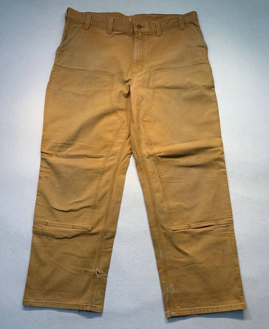 Carhartt Double Knee Worker Pants (Category: Jeans) located in Mandaluyong City. Submitted by theroom501 (Listing ID 1465358427, Image 2). Description: Carhartt Double Knee Worker Pants Style Code: 103334211 Size on Tag: 46 Color: Brown Condition: Good pre-owned condition with a heavily distressed vintage look. Flaws/Issues: Heavy distressing throughout the fabric Altered leg/sleeve length with visible stitching, indicating a previous modificatio