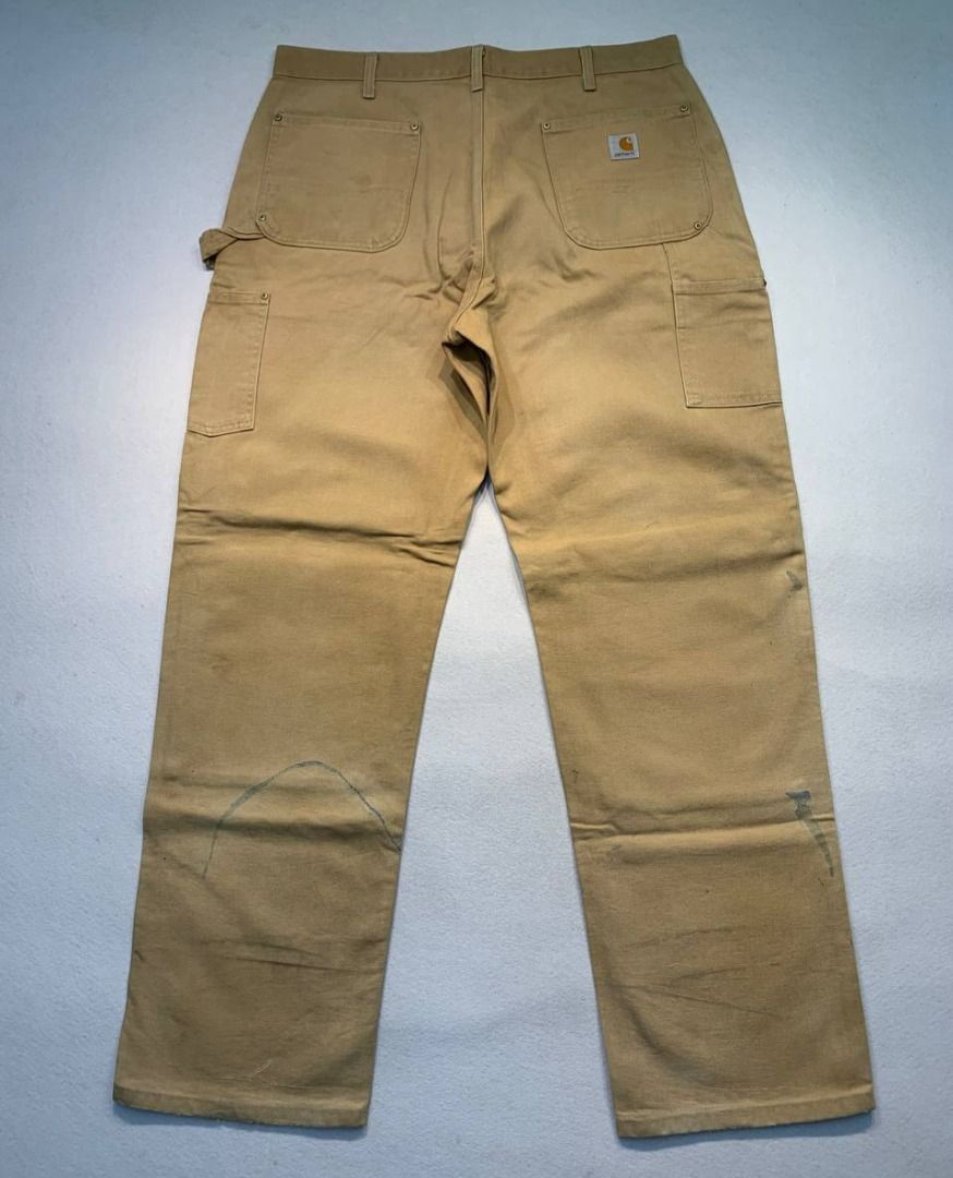 Carhartt Double Knee Worker Pants (Category: Jeans) located in Mandaluyong City. Submitted by theroom501 (Listing ID 1465359994, Image 1). Description: Carhartt Double Knee Worker Pants Style Code: BO1 BRN Size on Tag: 38 Color: Brown Condition: Good pre-owned condition with a heavily distressed vintage look. Flaws/Issues: Heavy distressing throughout the fabric paint stain. Flat Lay Measurements: Pit to Pit: 38 inches Length: 46 inches Leegopeni