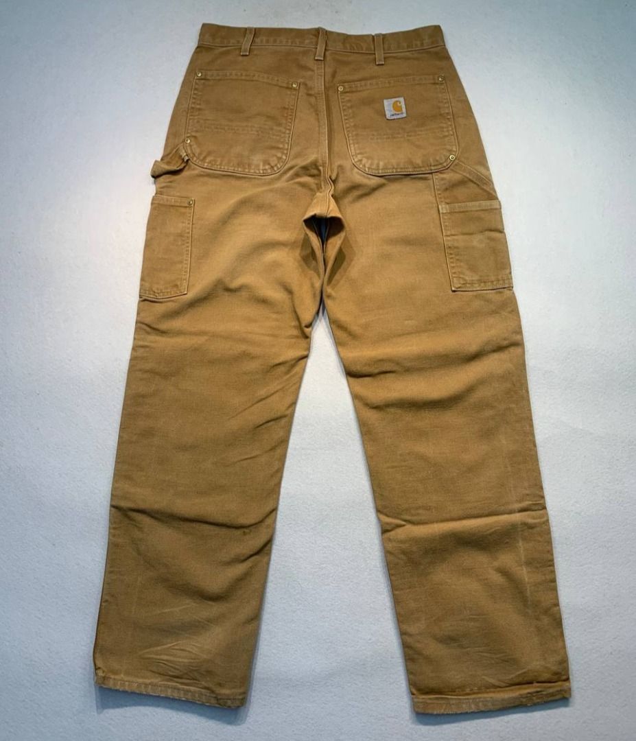 Carhartt Double Knee Worker Pants (Category: Jeans) located in Mandaluyong City. Submitted by theroom501 (Listing ID 1465361499, Image 1). Description: Carhartt Double Knee Worker Pants Style Code: BO1 BRN Size on Tag: 32 Color: Brown Condition: Good pre-owned condition with a heavily distressed vintage look. Flaws/Issues: Heavy distressing throughout the fabric paint stain. Flat Lay Measurements: Pit to Pit: 32 inches Length: 40.5 inches Leegope
