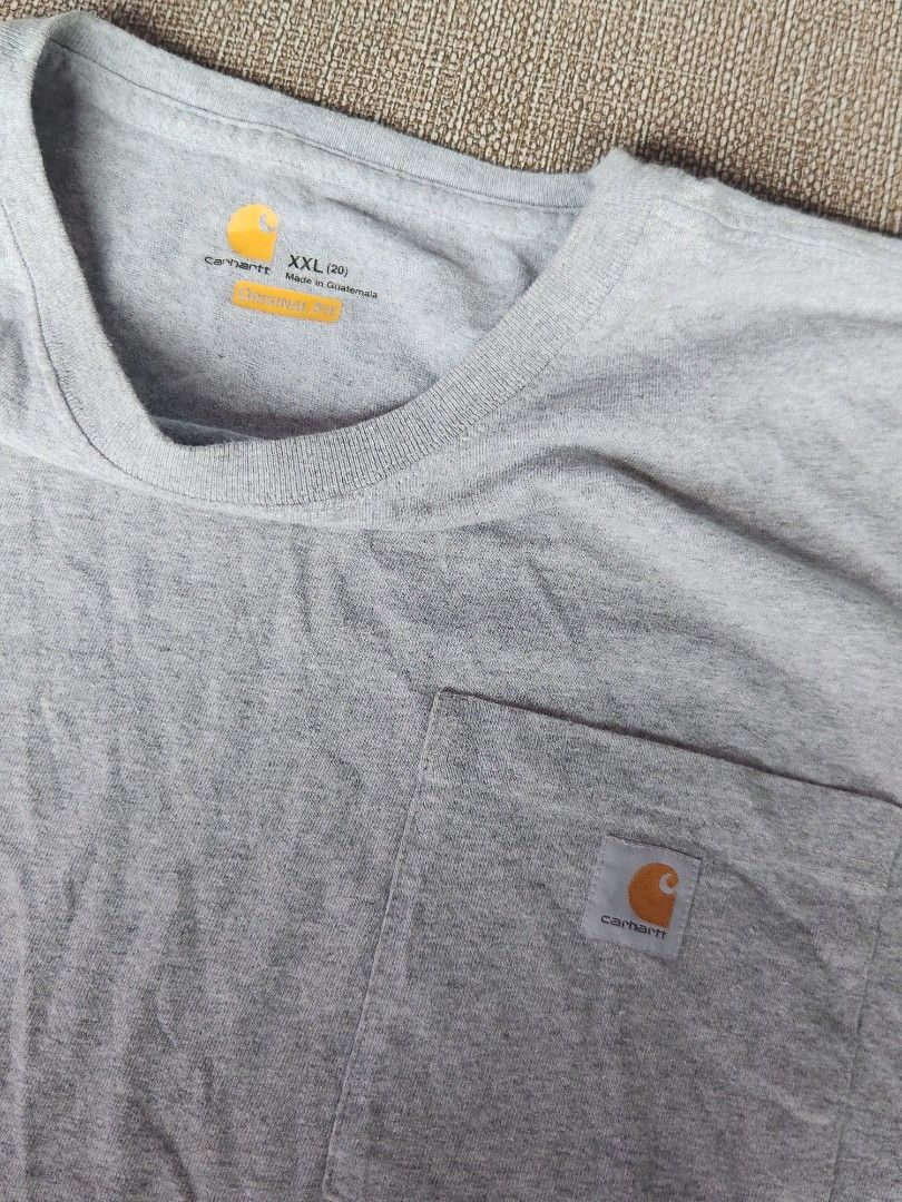 Carhartt pocket box type (Category: Tshirts & Polo Shirts ) located in Las Pinas. Submitted by jrwnrzn (Listing ID 1465302787, Image 2). Description: - Brand: Carhartt - Style: Original Fit Short Sleeve Pocket T-Shirt - Size: XXL box type 28L x 25w ganda sizing crop style - need wash - Color: Heather Grey - Material: Cotton and polyester blend (Made in Guatemala) - Details: Crew neck, small chest pocket with stitched Carhartt logo label, tags int