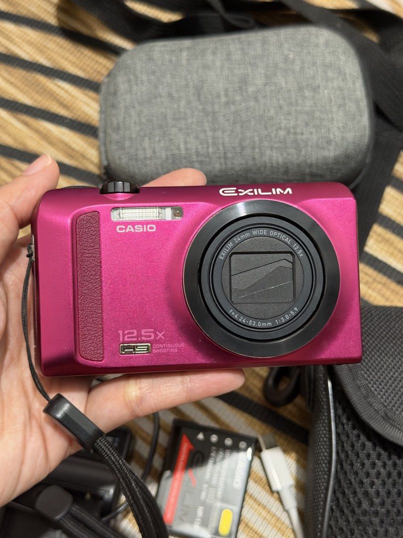 Casio Exilim EX-ZR200 Digital Camera (Category: Cameras) located in Manila. Submitted by _thepursela (Listing ID 1465331597, Image 2). Description: RFS: Rarely used Inclusion: 2 camera pouch/bag 2 Batteries 1 Universal Charger 1 SD card 1 Card reader.