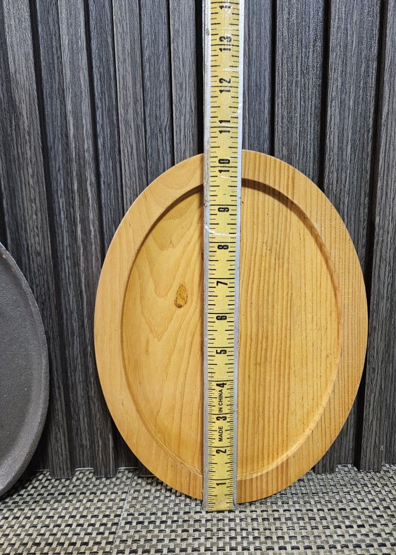 Cast Iron Sizzling Plate with Wooden Base (Category: Cookware & Accessories) located in Rizal. Submitted by cherry_garcia (Listing ID 1465293205, Image 3). Description: Oval cast iron sizzling skillet with matching wooden underliner. Pan measures about 14 inches total length, cooking surface width around 7 inches. Heavy duty construction retains heat well for serving steaks, fajitas, or sizzling dishes right at the table. Wooden base protects tab