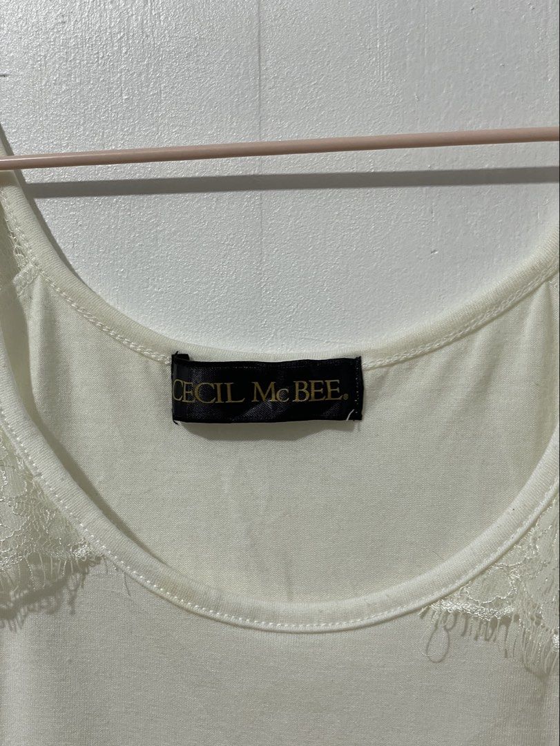 Cecil Mcbee White Lace Tank Top (Category: Sleeveless) located in Tuguegarao City. Submitted by ziggerryy (Listing ID 1465371131, Image 2). Description: No flaws. No holes Can pass as brandnew S-M.