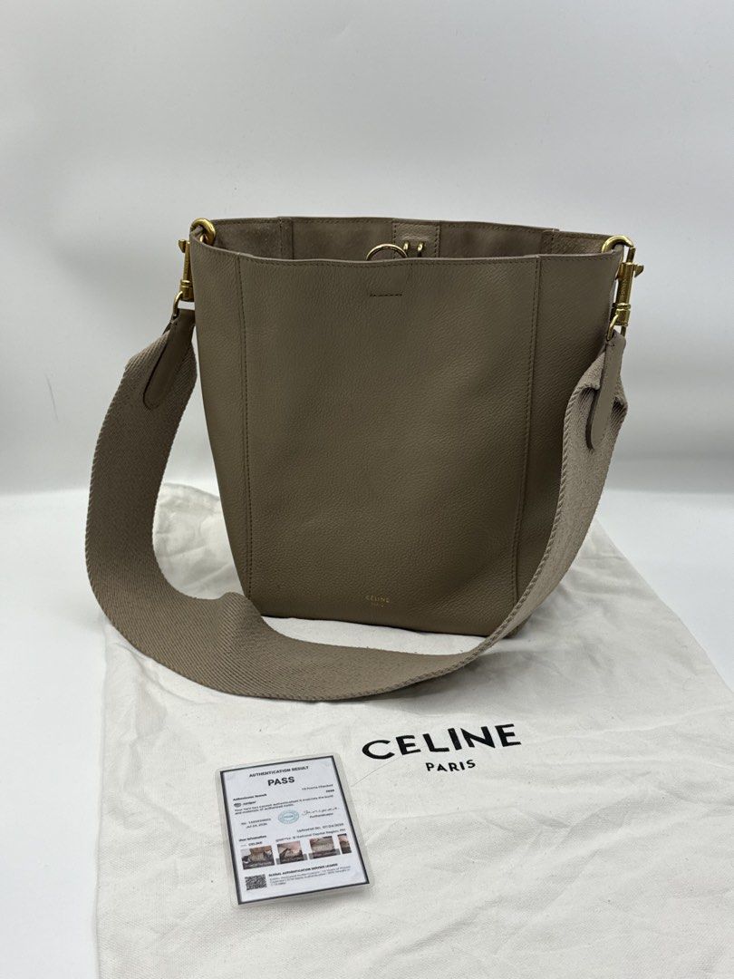 Celine Bucket Bag (Category: Cross-body Bags) located in Caloocan City. Submitted by rossvault2 (Listing ID 1465230657, Image 1). Description: - Brand: Celine - Material: Taupe grained leather with suede interior - Hardware: Gold-tone - Strap: Wide canvas shoulder strap - Inclusions: Dust bag and authentication card - Condition: Minimal signs of handling, very clean interior.