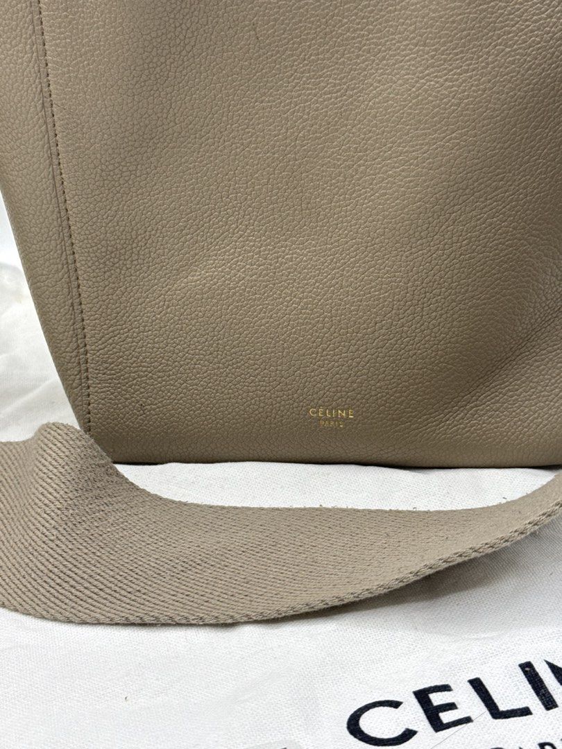 Celine Bucket Bag (Category: Cross-body Bags) located in Caloocan City. Submitted by rossvault2 (Listing ID 1465230657, Image 3). Description: - Brand: Celine - Material: Taupe grained leather with suede interior - Hardware: Gold-tone - Strap: Wide canvas shoulder strap - Inclusions: Dust bag and authentication card - Condition: Minimal signs of handling, very clean interior.
