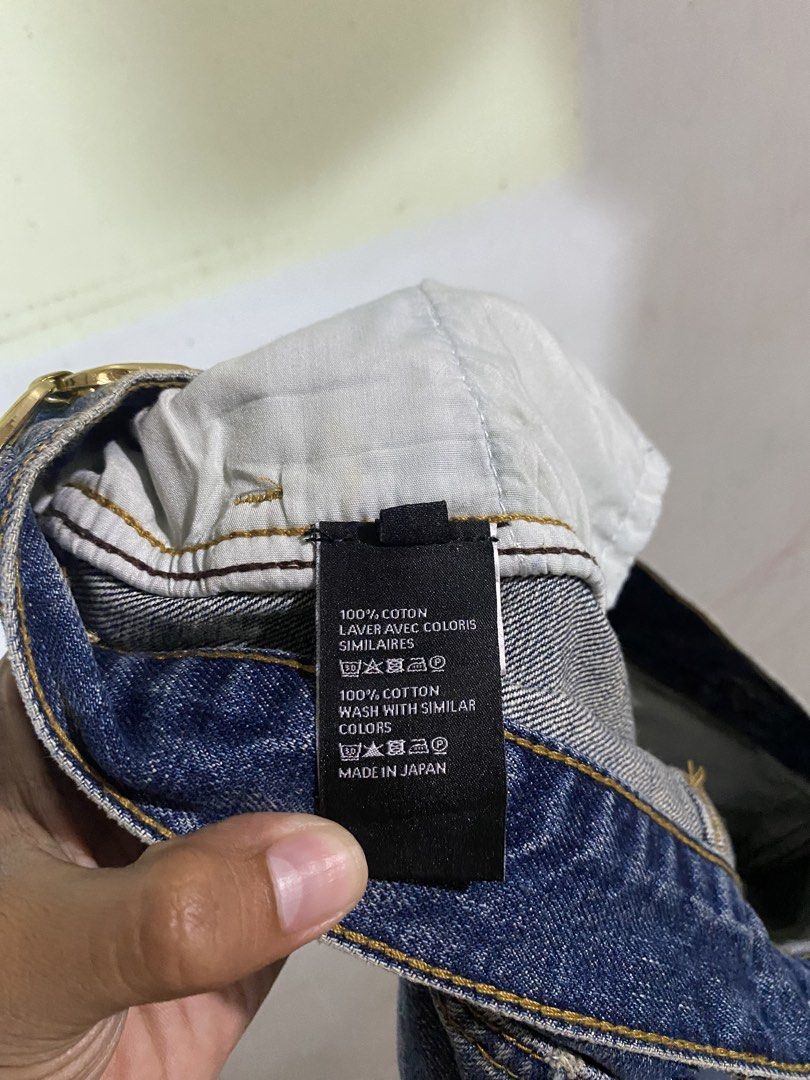 Celine Denim Jeans Made in Japan (Category: Jeans) located in Pandi. Submitted by nasya_thrift_collection2023 (Listing ID 1465307250, Image 3). Description: - Brand: Celine - Material: 100% Cotton, crafted in Japan - Color: Classic Blue - Fit: Straight leg cut, mid-weight denim - Details: Unique gold hardware chain links on the waistband, standard front pockets - Authenticity: Inner waistband stamped with style codes W FL 009 N286 930F 07UW - Con