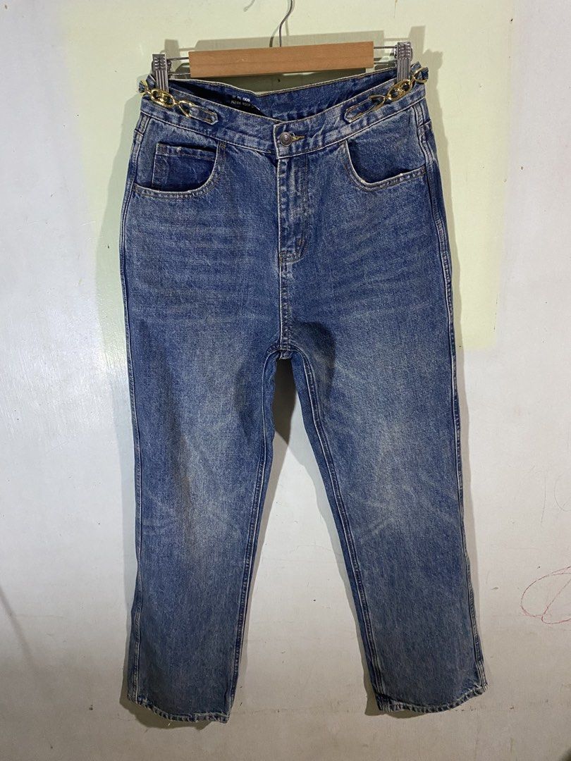 Celine Denim Jeans Made in Japan (Category: Jeans) located in Pandi. Submitted by nasya_thrift_collection2023 (Listing ID 1465307250, Image 1). Description: - Brand: Celine - Material: 100% Cotton, crafted in Japan - Color: Classic Blue - Fit: Straight leg cut, mid-weight denim - Details: Unique gold hardware chain links on the waistband, standard front pockets - Authenticity: Inner waistband stamped with style codes W FL 009 N286 930F 07UW - Con