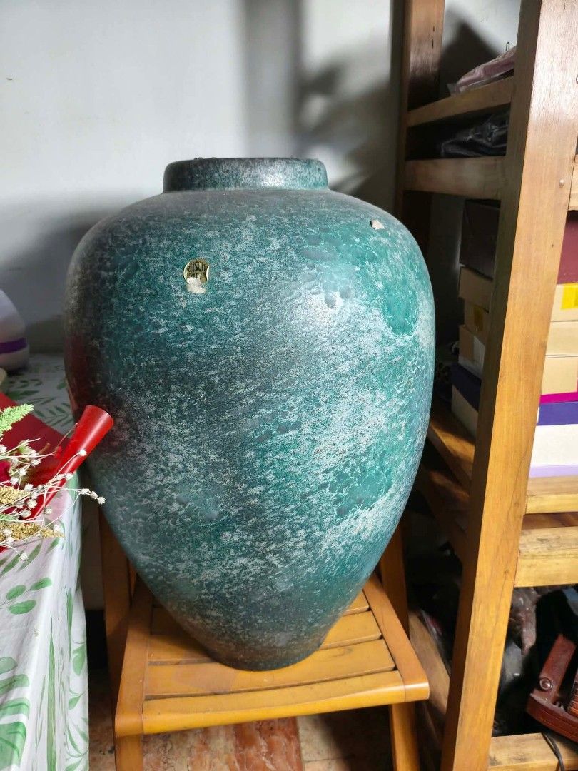 Ceramic jar (Category: Vases & Decorative Bowls) located in Quezon City. Submitted by swiftmoonart (Listing ID 1465335066, Image 1). Description: vintage textured ceramic jar finished with a mottled green mineral patina or lava glaze. not sur3 of I'm thinking if comes from German Art pottery as brand sticker shown is. height is 3ft...