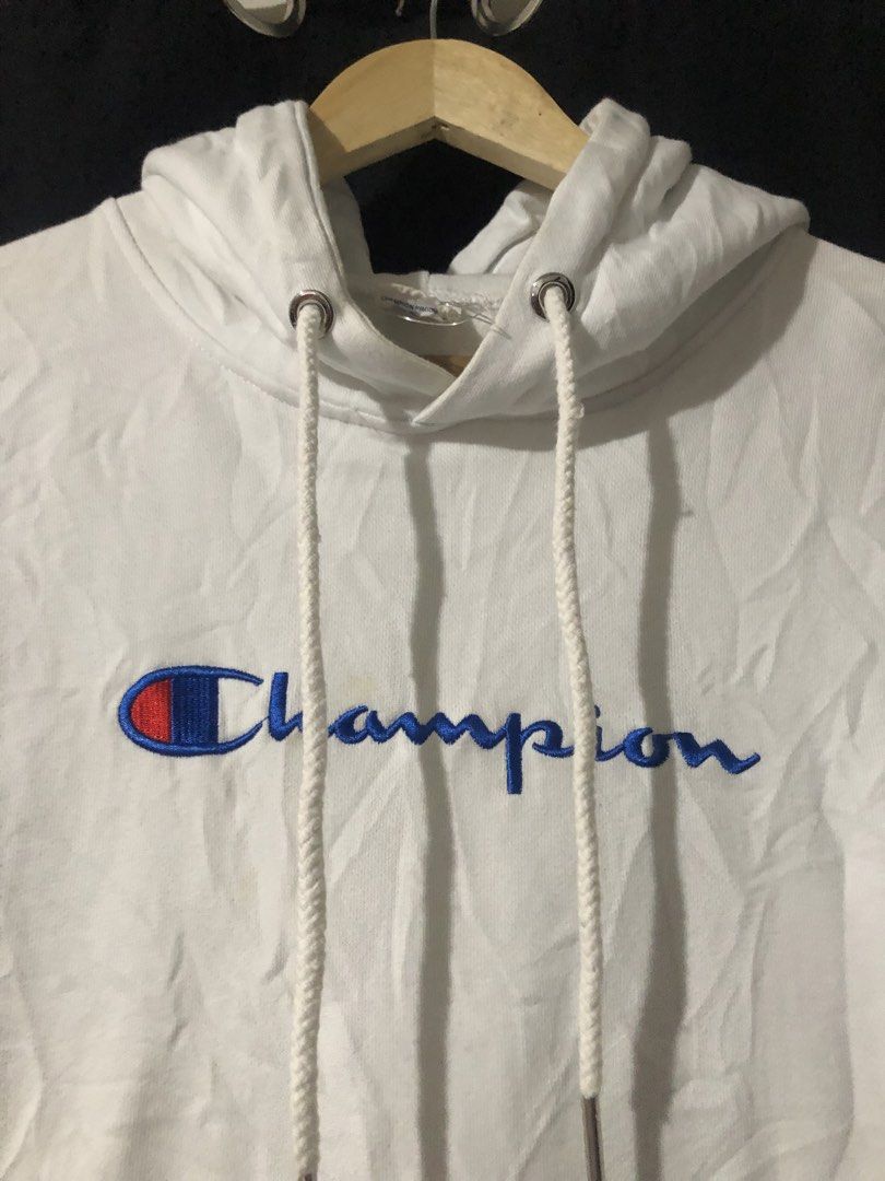 Champion White Hoodie Size Small (Category: Hoodies) located in Quezon City. Submitted by yeahsource222 (Listing ID 1465206364, Image 3). Description: - Brand: Champion - Size: Small - Color: White - Design: Classic embroidered script logo on chest and multi-logo prints on left sleeve - Features: Drawstring hood, front kangaroo pocket - Condition: Great casual piece for everyday wear, authentic tagging.