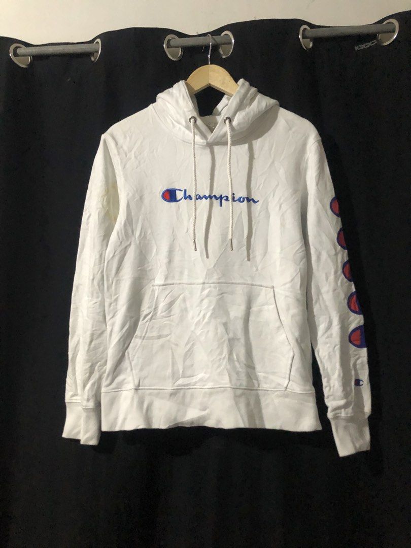 Champion White Hoodie Size Small (Category: Hoodies) located in Quezon City. Submitted by yeahsource222 (Listing ID 1465206364, Image 1). Description: - Brand: Champion - Size: Small - Color: White - Design: Classic embroidered script logo on chest and multi-logo prints on left sleeve - Features: Drawstring hood, front kangaroo pocket - Condition: Great casual piece for everyday wear, authentic tagging.