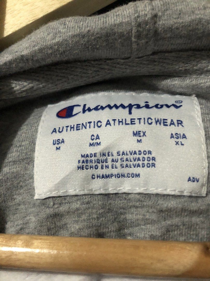 Champion White Pullover Hoodie Size M (Category: Hoodies) located in Quezon City. Submitted by yeahsource222 (Listing ID 1465206257, Image 3). Description: - Brand: Champion - Color: White - Size: Medium (true to size) - Material: 50% Cotton, 50% Polyester (Made in El Salvador) - Design: Drawstring hood, front pocket, classic embroidered logo on chest, signature patch on left wrist - Flaw: Minor yellowish stain located on the lower left sleeve ne