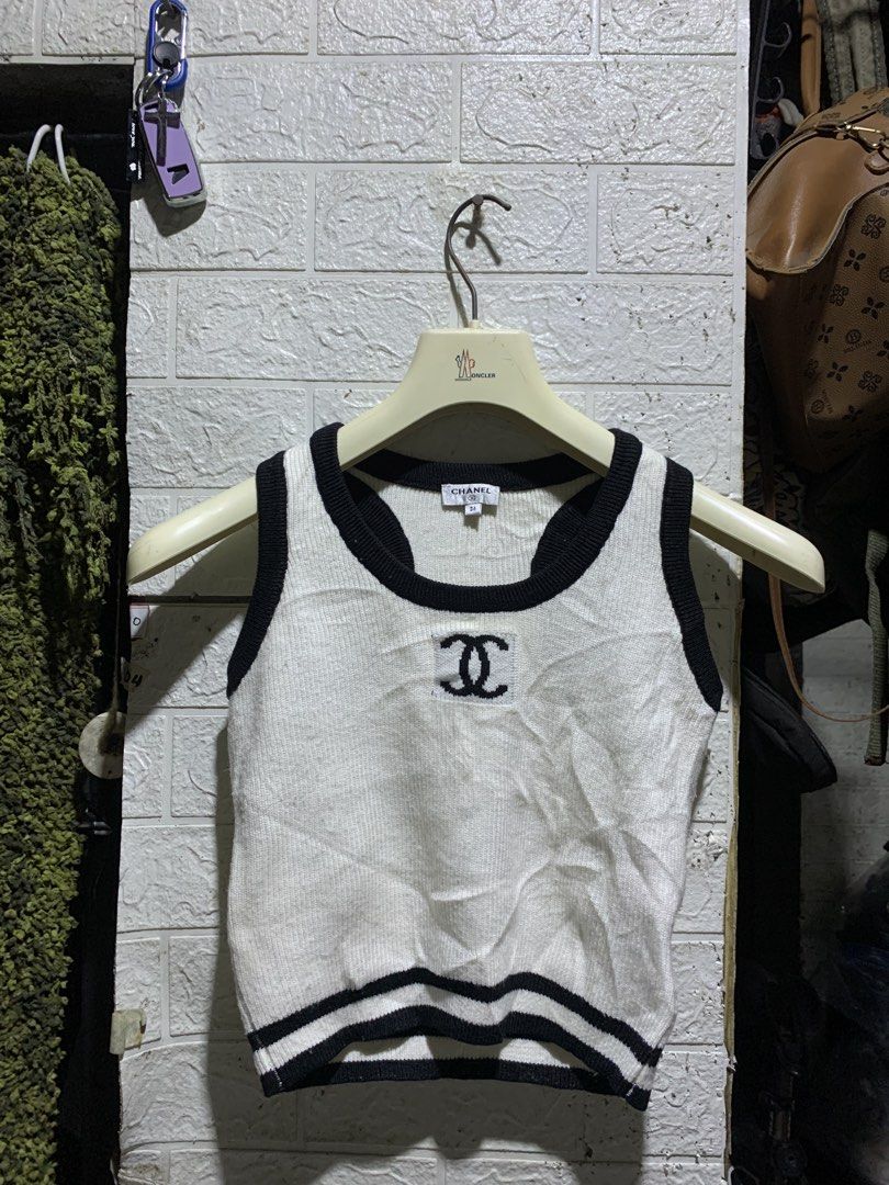 CHANEL KNIT TANK TOP (Category: Luxury Apparel) located in General Trias. Submitted by kyledeterala6969 (Listing ID 1465274872, Image 3). Description: Chanel Knit Top No issue Like new Color rate - 10/10 Length - 17 Pit to pit - 14.5 Stretchable Location: General Trias City, Cavitte.