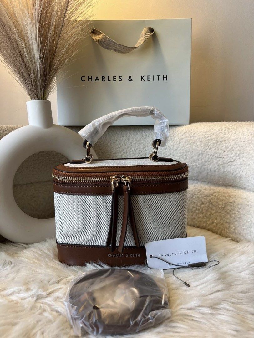 Charles & Keith Canvas Vanity Sling Bag (Category: Cross-body Bags) located in Pasig City. Submitted by preloved.closet2 (Listing ID 1465377665, Image 1). Description: Vanity Style Sling Bag Color canvas 2tone Add paperbag plus 80 .