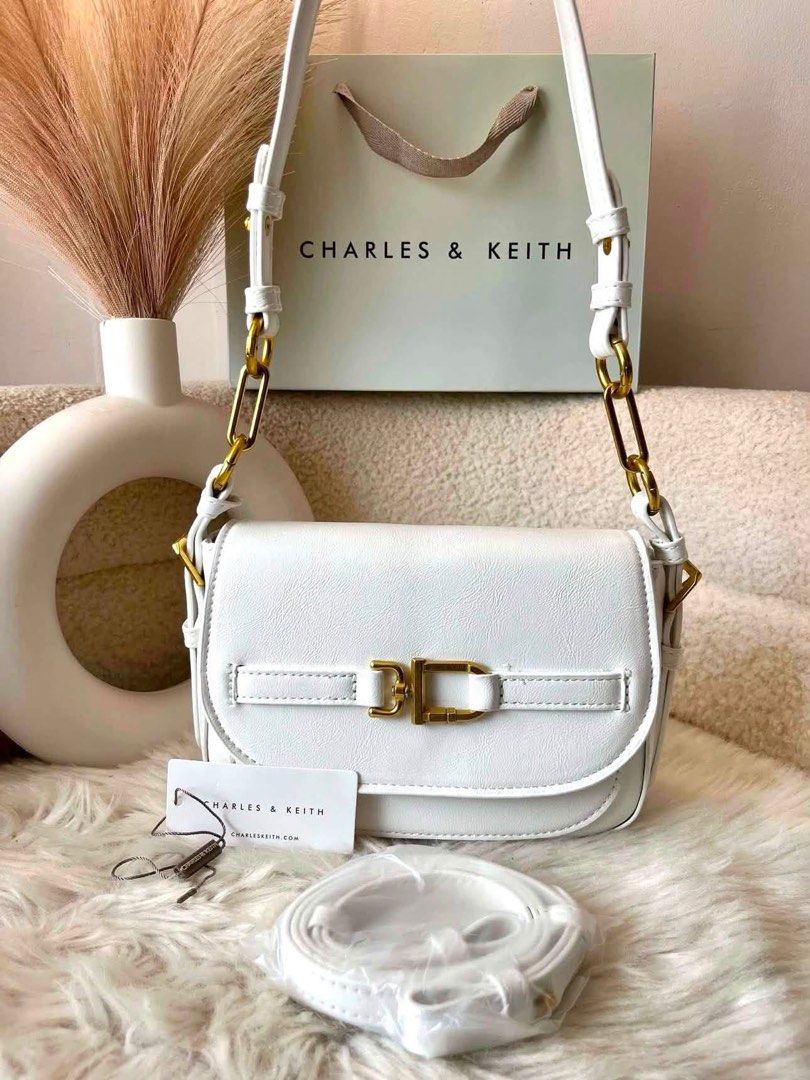 Charles & Keith Chain Shoulder Bag - White (Category: Shoulder Bags) located in Pasig City. Submitted by preloved.closet2 (Listing ID 1465378797, Image 1). Description: 2Way Bag With Sling Size 8 inches Color white Add paperbag plus 80 .