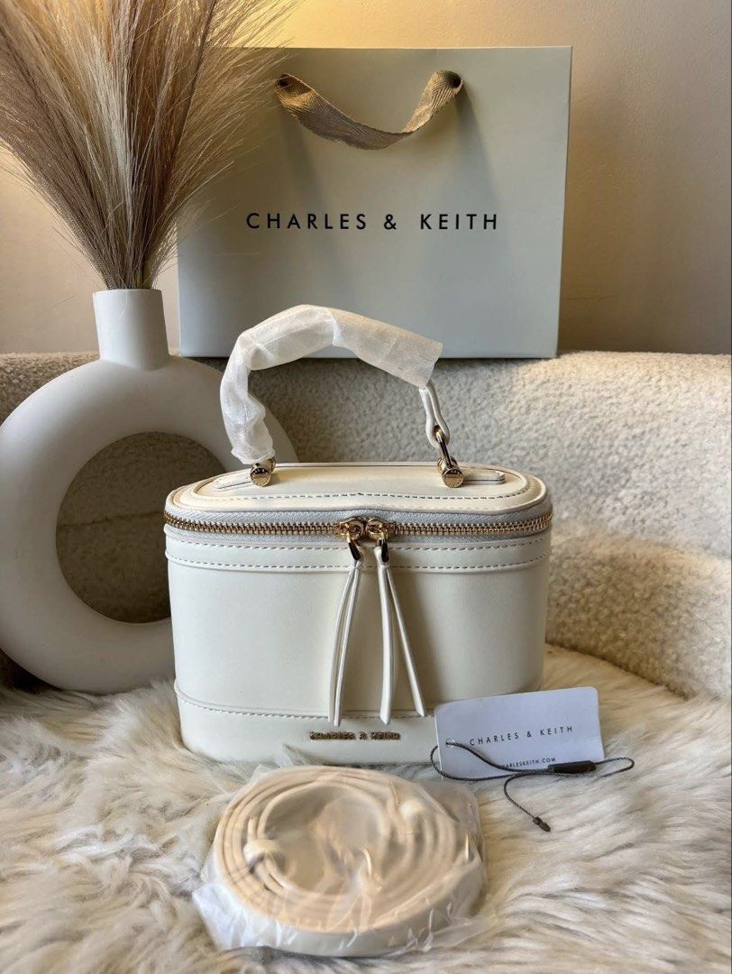 Charles & Keith Vanity Sling Bag- Cream (Category: Cross-body Bags) located in Pasig City. Submitted by preloved.closet2 (Listing ID 1465377829, Image 1). Description: Vanity Style Sling Bag Color cream Add paperbag plus 80 .