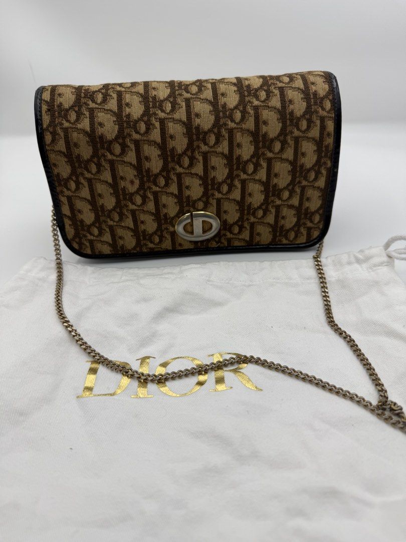 Christian Dior Shoulder Bag (Category: Shoulder Bags) located in Caloocan City. Submitted by rossvault2 (Listing ID 1465238821, Image 2). Description: - Brand: authentic Christian Dior - Style: Shoulder Bag - Material/Design: Brown Oblique canvas with dark piping - Hardware: Gold-tone chain strap and iconic CD front clasp - Inclusion: Original white Dior dust bag with gold foil logo - Condition: Excellent pre-loved condition/see pics for signs of