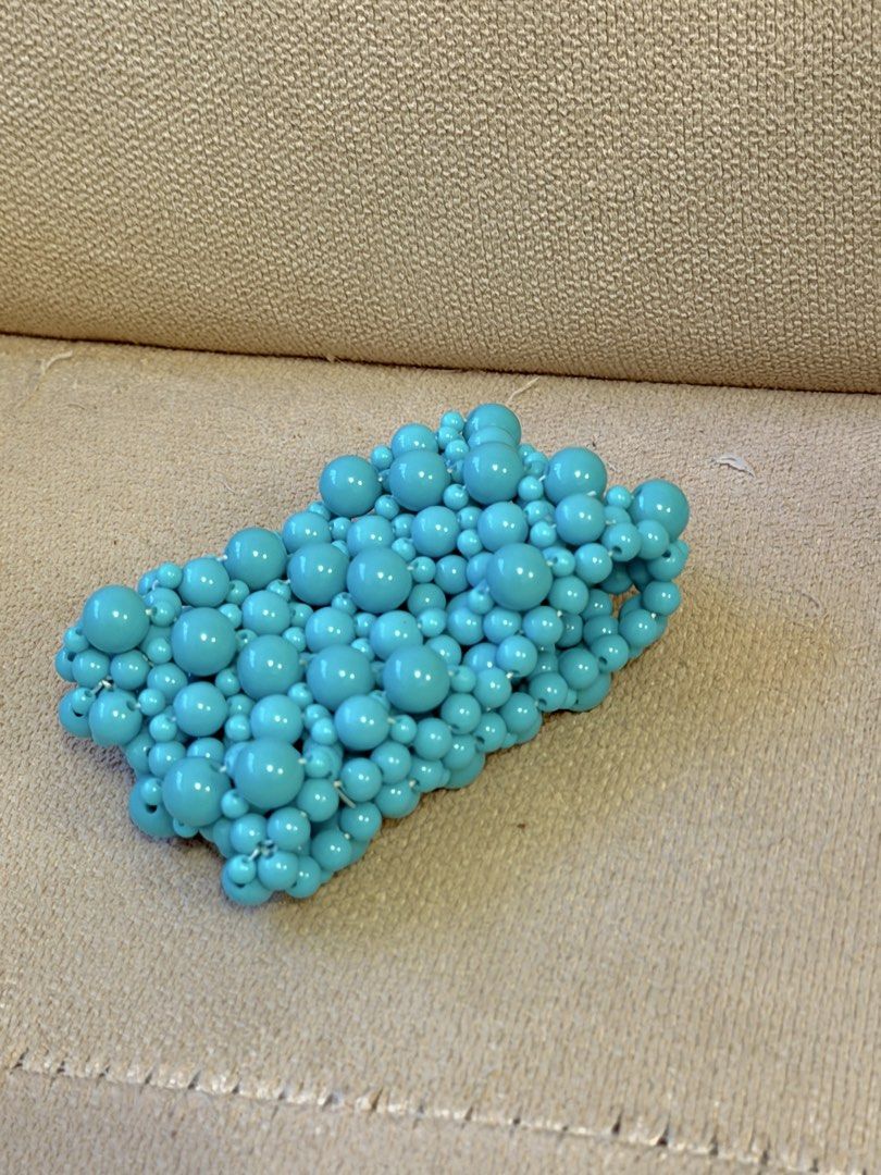 Chunky Turquoise Blue Beaded Statement Cuff Bracelet (Category: Bracelets) located in Pasig City. Submitted by miss_abuelita (Listing ID 1465261351, Image 3). Description: Bold multi-strand cuff bracelet made of glossy turquoise blue beads in various sizes. Wide design covers a good portion of the wrist. Stretchable construction fits comfortably without clasp hardware. Vibrant pop of color for casual outfits or summer wear. Lightweight plastic ma